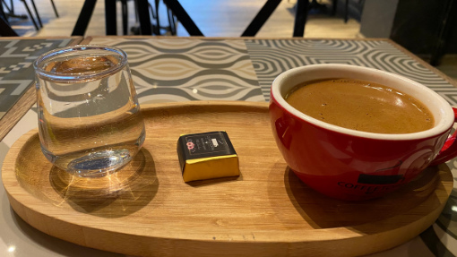 Turkish coffee setting on a wooden platter in a restaurant