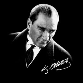 A black and white photo of Ataturk with his signature. 