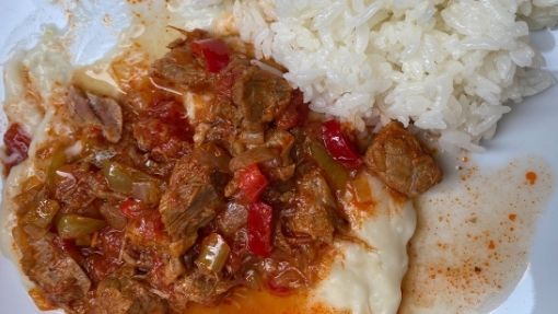 Hünkarbeğendi which is a tomato sauce based lamb dish served a top of a creamed eggplant puree