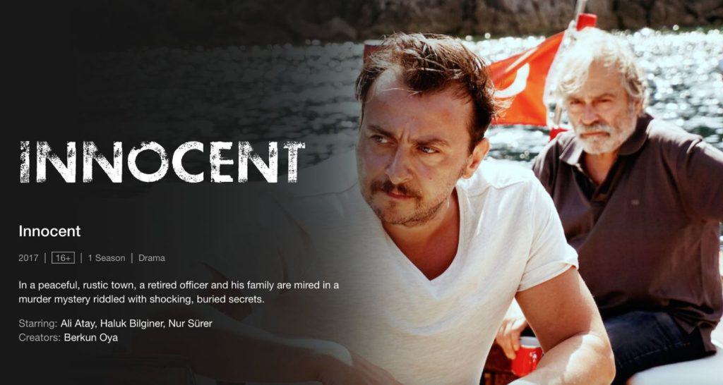 Innocent on Netflix with two men in a boat on the lake