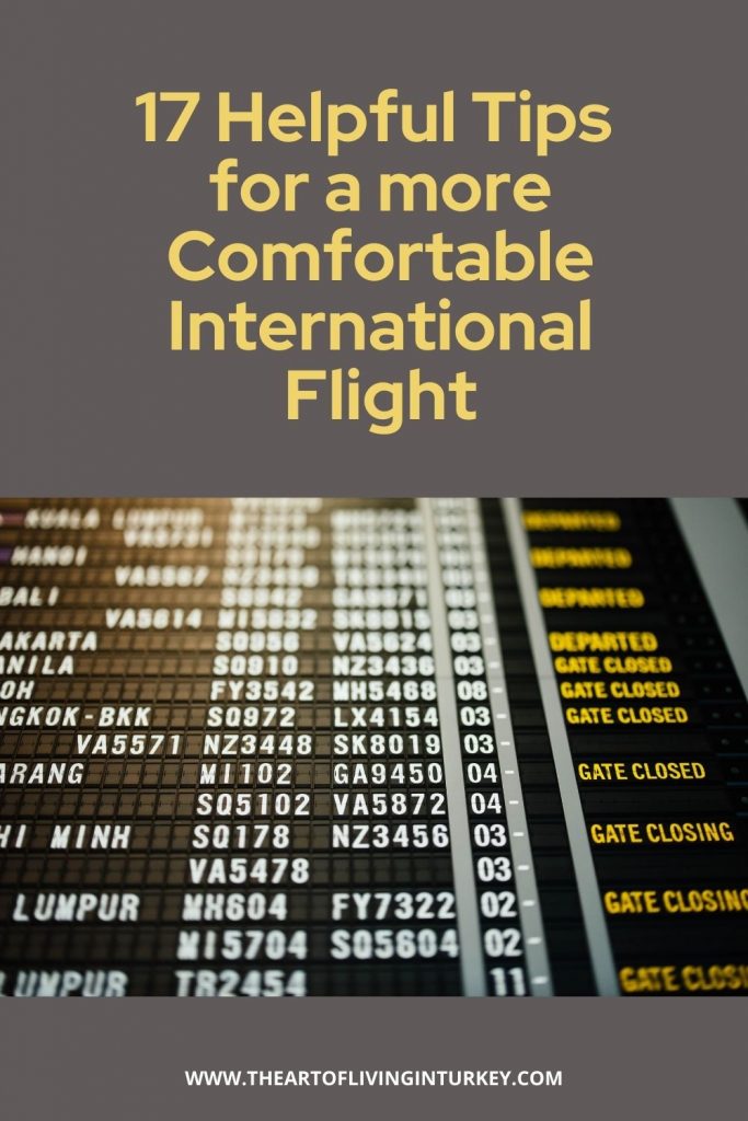 pinterest graphic for 17 helpful tips for a more comfortable International flight with a gate list in the background