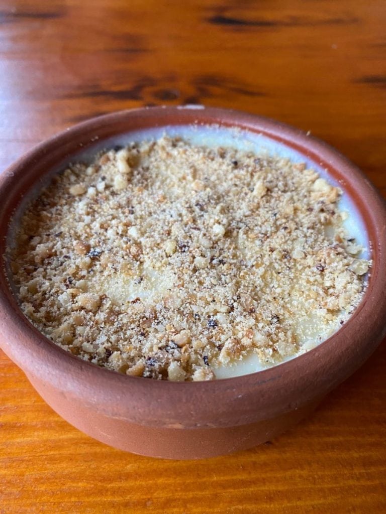 traditional firindan sutlac or oven rice pudding dusted with crushed peanuts