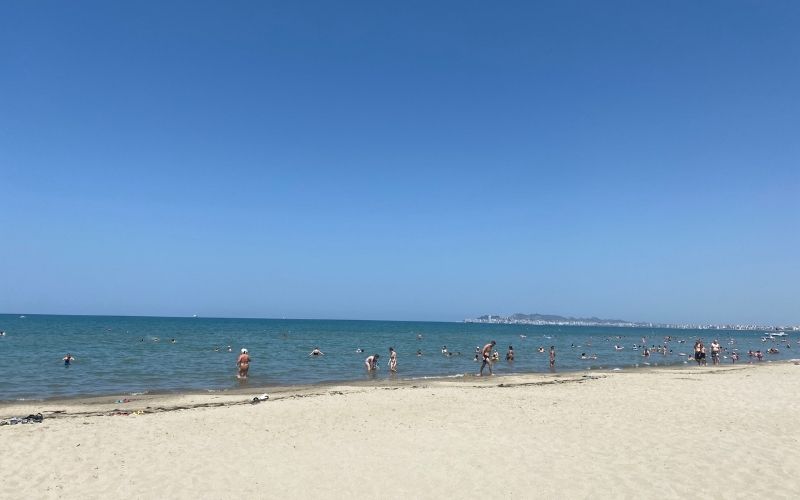 Golem Long Beach Durres, Albania  with people swimming on a sunny day