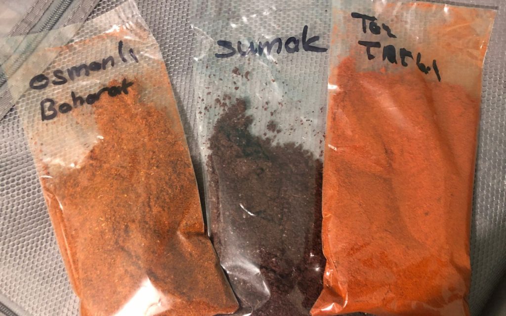 Ottoman spice, sumak spice. and powdered sweet pepper in small plastic bags