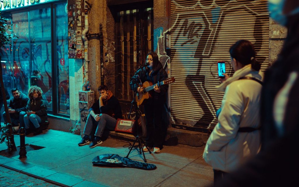 Musician in Istanbul on the streets playing a guitar