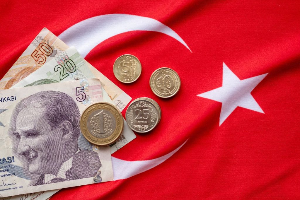 turkish money on turkish flag - Tipping in Turkey
