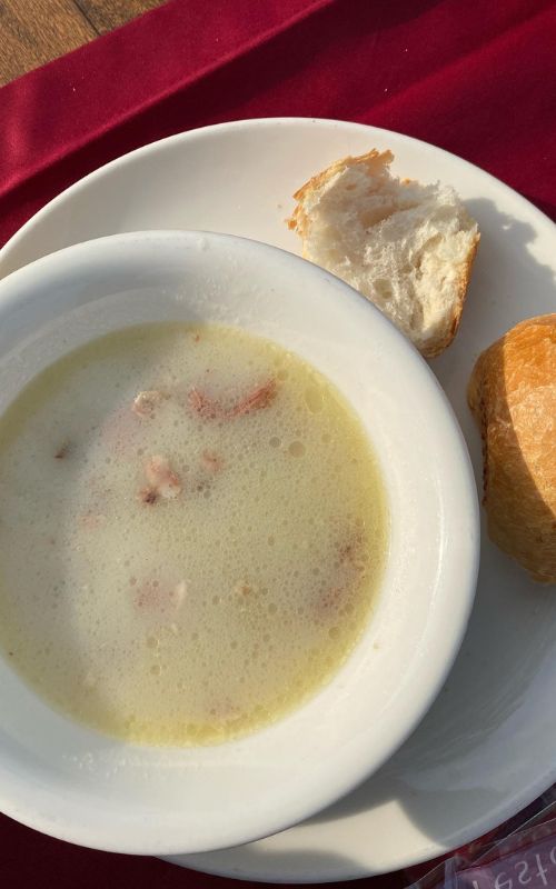 fish soup in the black sea region with a roll on the side. 