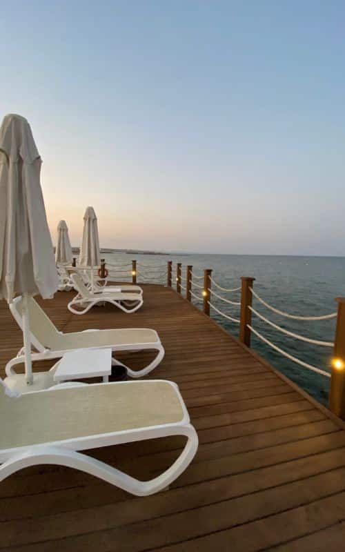 beach chairs on the Concorde luxury resort private dock