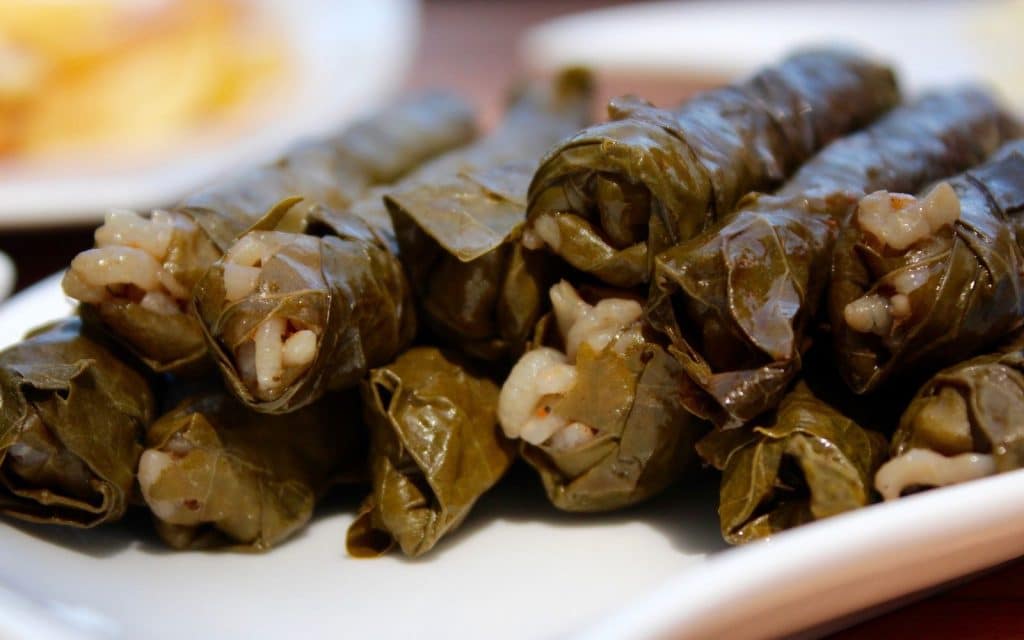 Sarma which is a rice and seasoning mixture wrapped in grape leaves - Turkish Meze