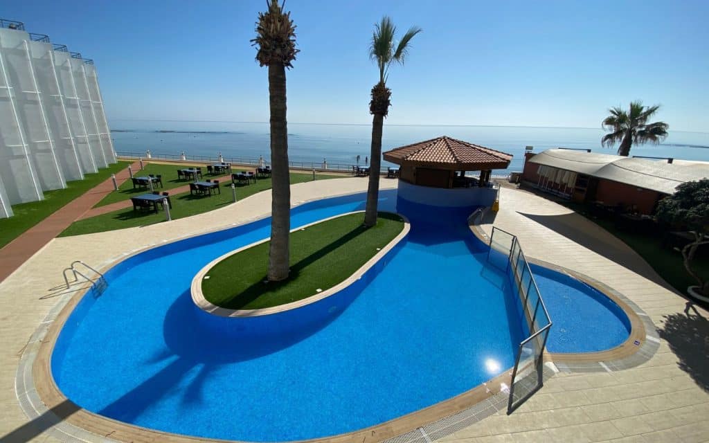 the beautiful pool at Mimosa Hotel with the beach in the background