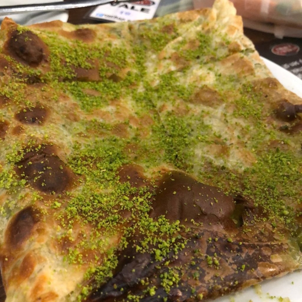 Katmer - a phylo do stuffed with cheese and sprinkled with pistachios
