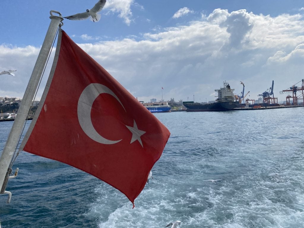 Turkish flag flying off the back of a ferry