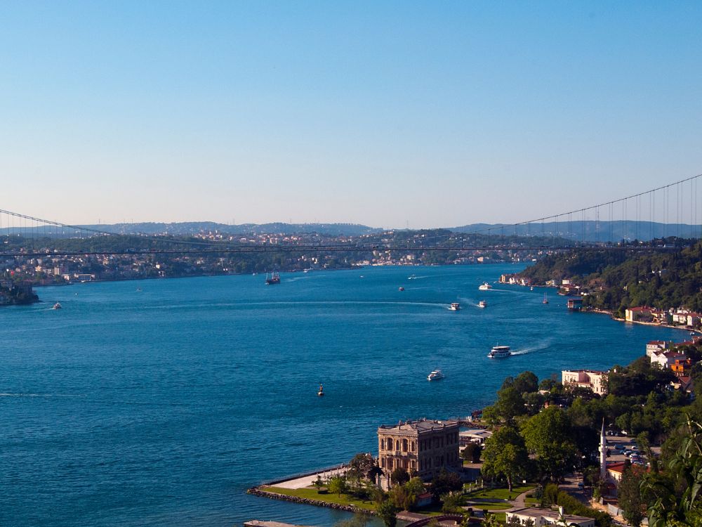 Stunning view of the Bosphorus close. to the second bridge. Many boats are out on the water and the sky is clear