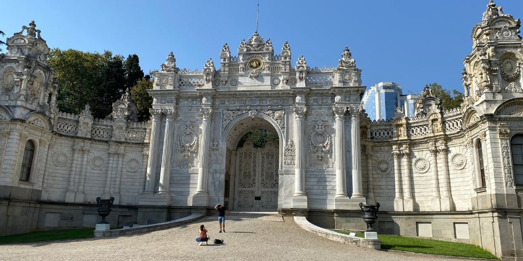 Dolmabahce Palace gates. White gates with gold inlays.