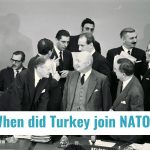 Group of men signing Turkey into NATO answering the question of When did Turkey join NATO?