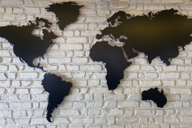 A world map on a brick background for a post about men in Turkey