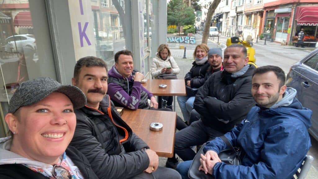 kimberly sitting at a cafe in Kadıköy while on a field trip with her turkish real estate classmates