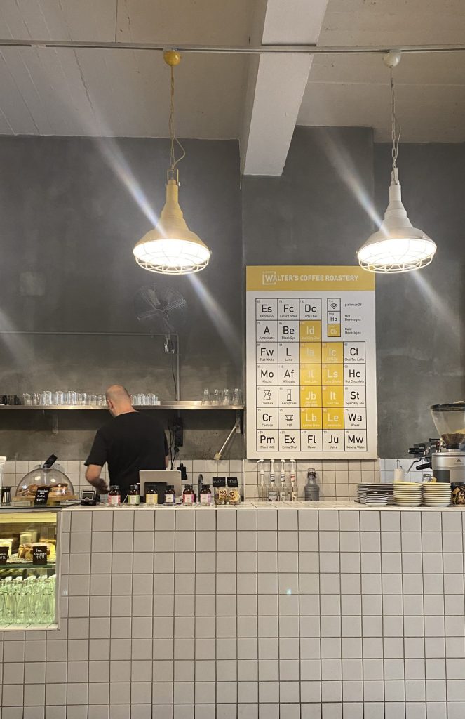 a faux chemical chart as the menu with tall ceilings and a theme from Breaking Bad