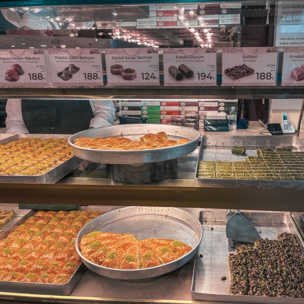 A store front with 6 different types of baklava