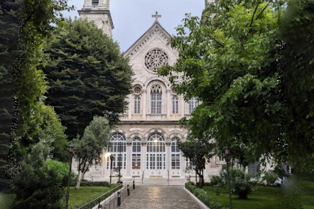 Hagia Triad Church from the front with Trees in the forefront