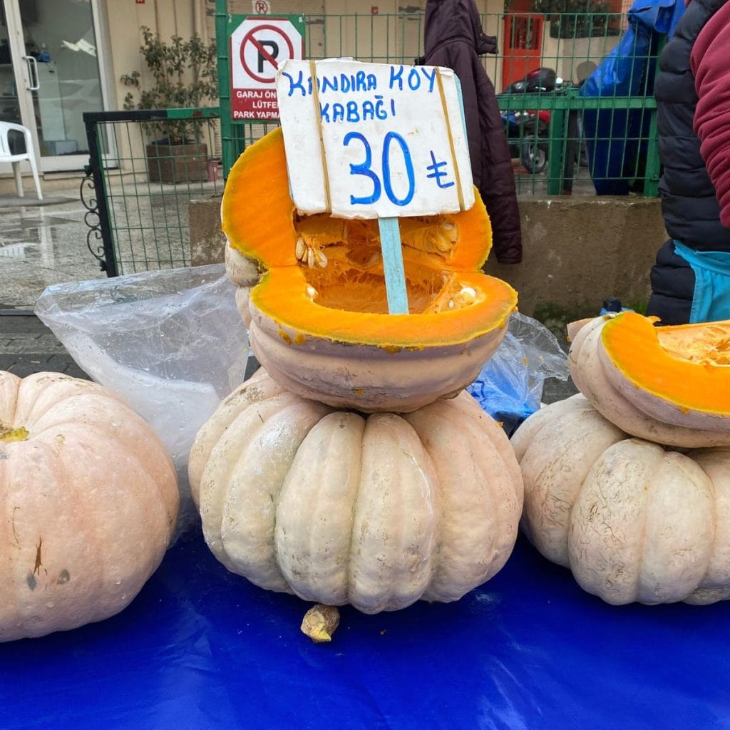 Whole pumpkins at a local fruit and vegetable market.