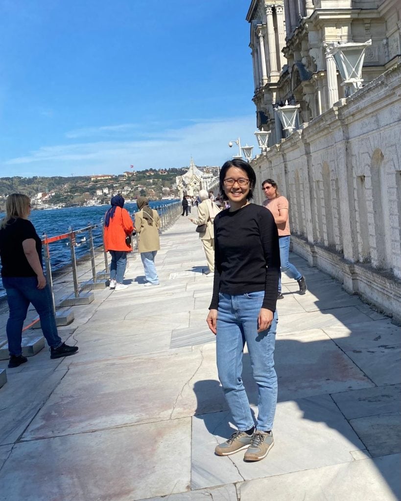 Blog author Michelle standing by the Bosphorus next to Beylerbeyi Palace in April