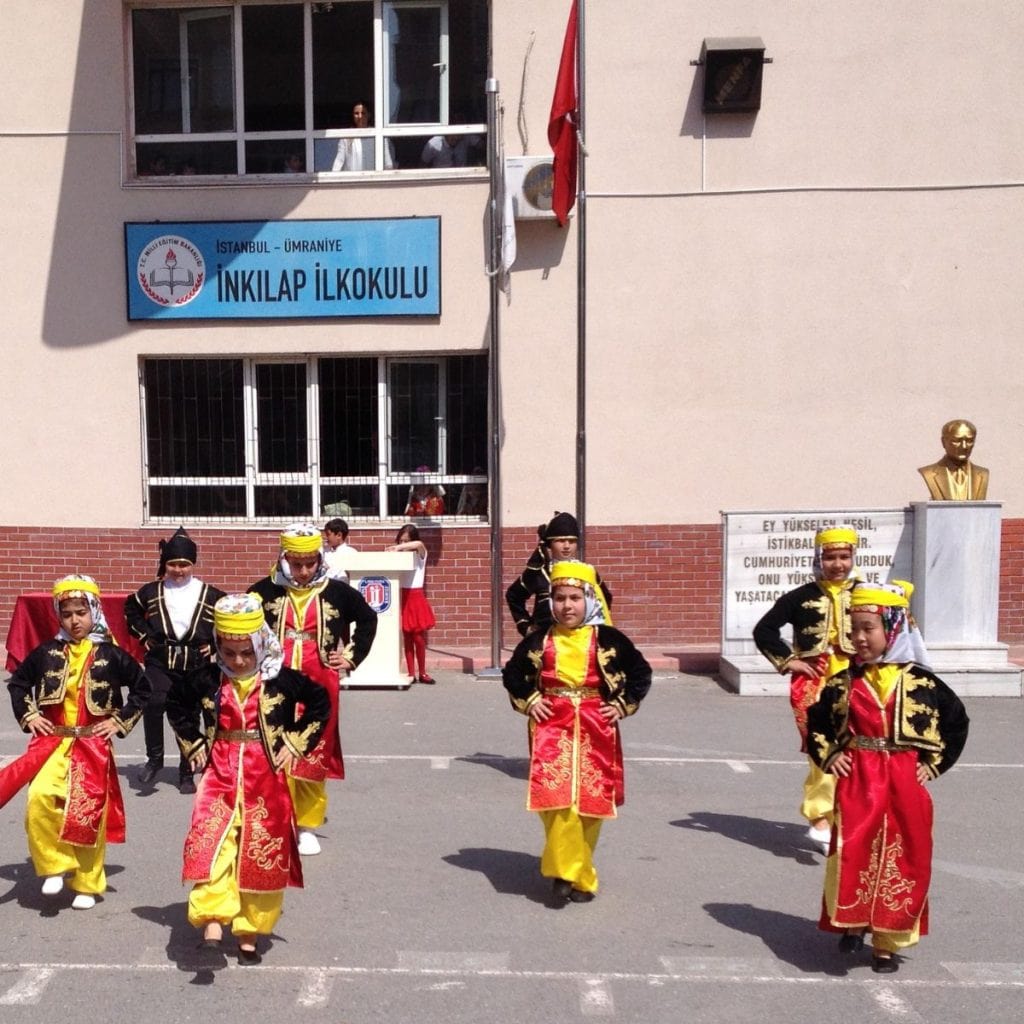 Children perform a Turkish traditional folk dance at a Children's Day celebration in Spring.