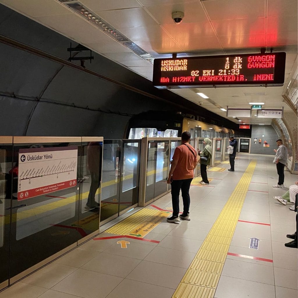 People waiting for the arrival of the metro at a station in Istanbul.