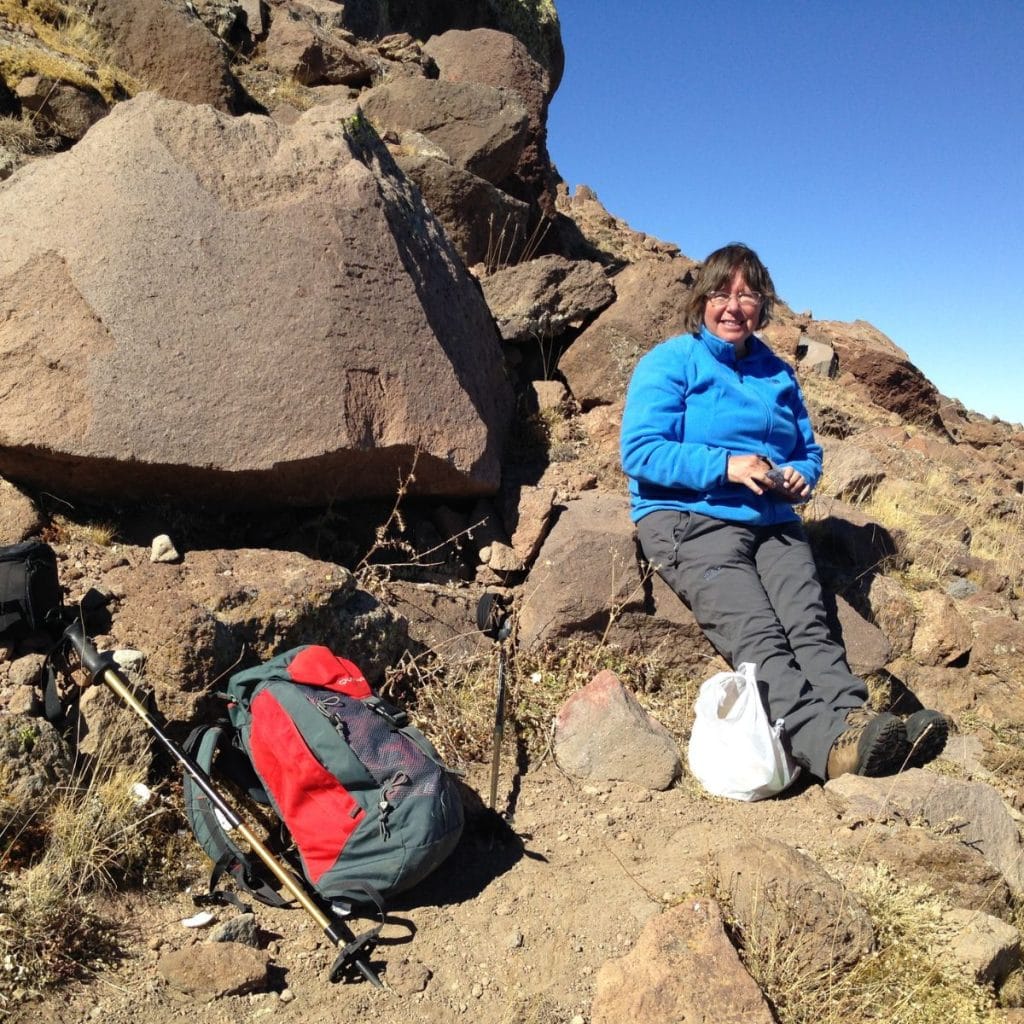 Pat Yale rests at the top of Mount Hasan