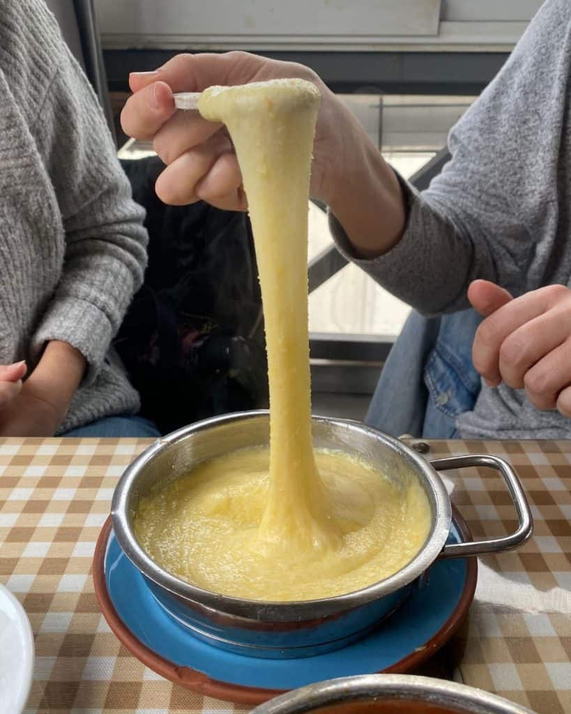 Delicious Turkish cheese dip made of butter, corn meal and stringy cheese called Muhlama