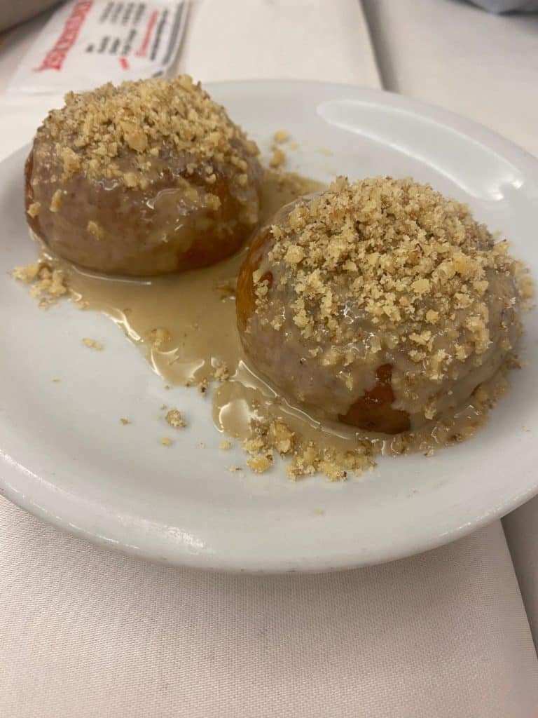 sweet pumpkin dish with tahini and nuts over it